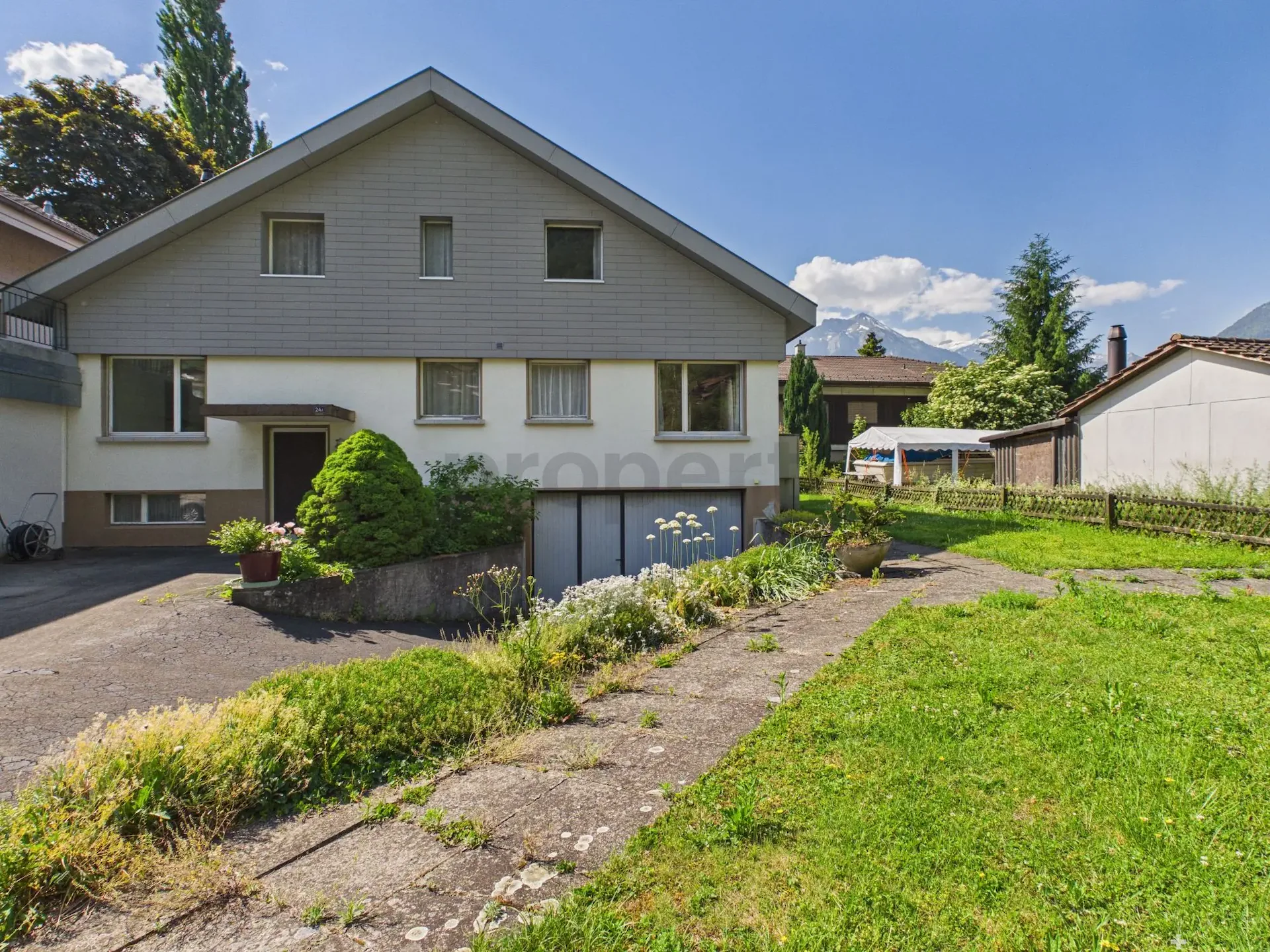 Vaste maison de famille de 6,5 pièces avec jardin dans un emplacement unique sur l'Aare à Interlaken