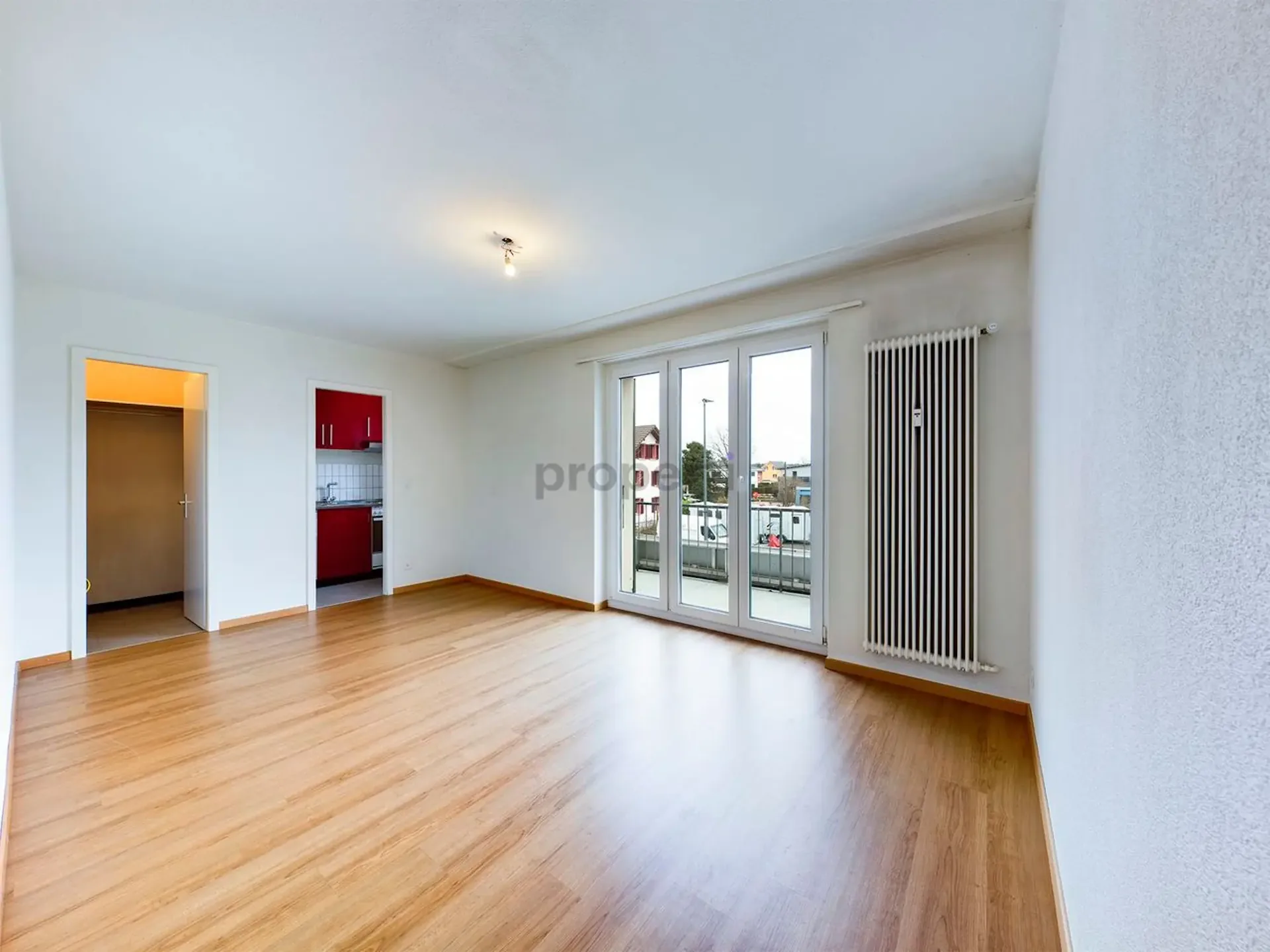 Bright living area, cozy balcony and separate kitchen concept
